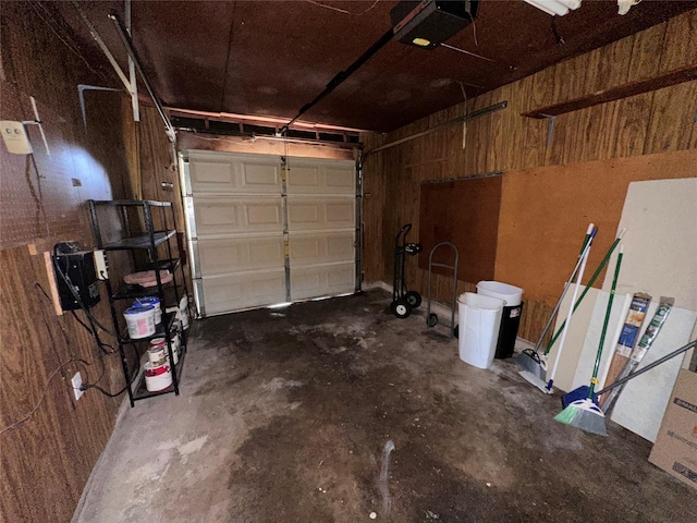 1664 Poplar Dr, Mesquite, TX 75149 - garage featuring a garage door opener and wood walls