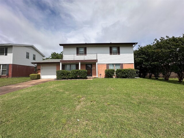 1664 Poplar Dr, Mesquite, TX 75149 - traditional-style house featuring a garage, concrete driveway, brick siding, and a front yard