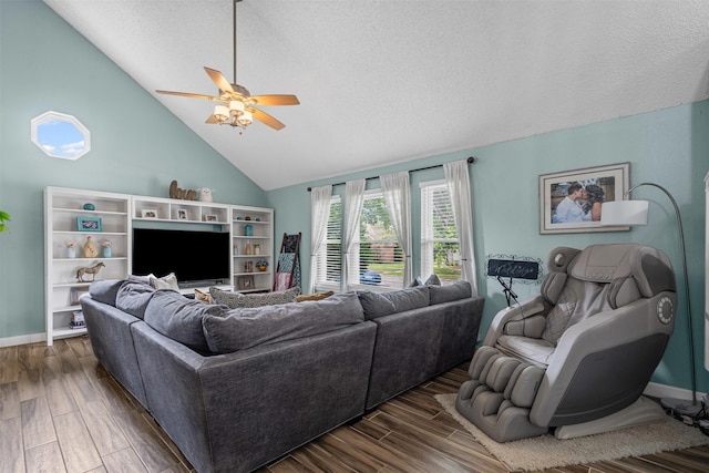 7012 Fox Dr, The Colony, TX 75056 - living area with a ceiling fan, dark wood finished floors, vaulted ceiling, a textured ceiling, and baseboards