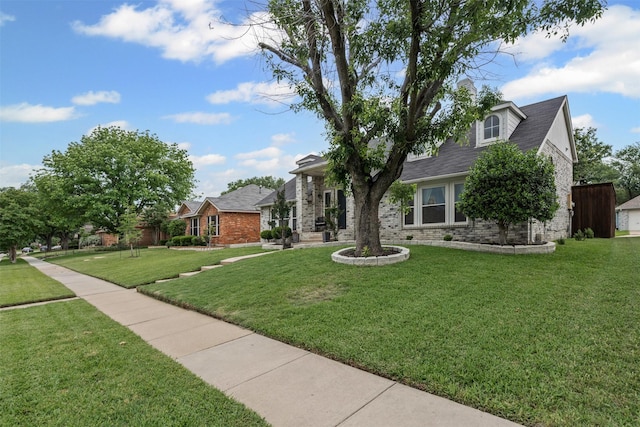 7012 Fox Dr, The Colony, TX 75056 - view of front facade with a front yard and brick siding