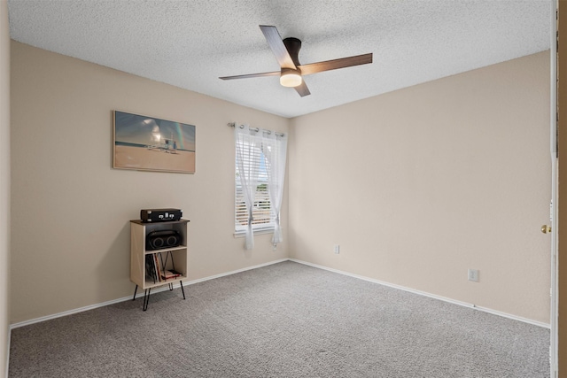 7012 Fox Dr, The Colony, TX 75056 - empty room featuring a ceiling fan, a textured ceiling, carpet, and baseboards