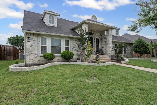 7012 Fox Dr, The Colony, TX 75056 - view of front facade featuring brick siding and a chimney
