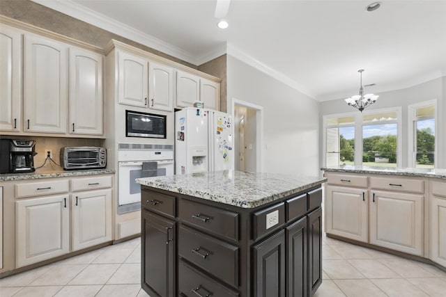 kitchen with white appliances, a chandelier, light tile patterned flooring, ornamental molding, and decorative light fixtures