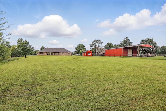 view of yard featuring an outbuilding and a pole building