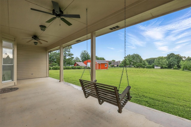 view of patio with a ceiling fan and an outbuilding