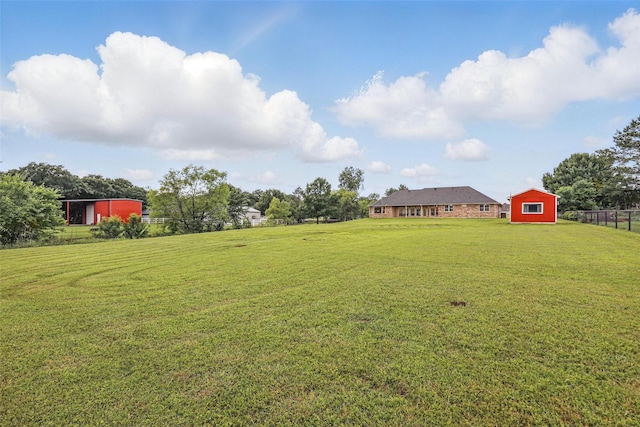 view of yard with an outdoor structure
