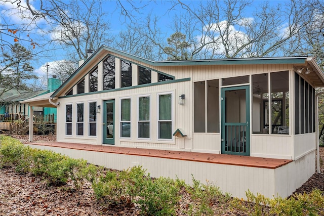 168 Knollwood Ln, Holly Lake Ranch, TX 75765 - rear view of house featuring a sunroom