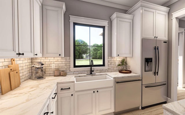 kitchen featuring stainless steel refrigerator with ice dispenser, white dishwasher, a sink, white cabinetry, and tasteful backsplash