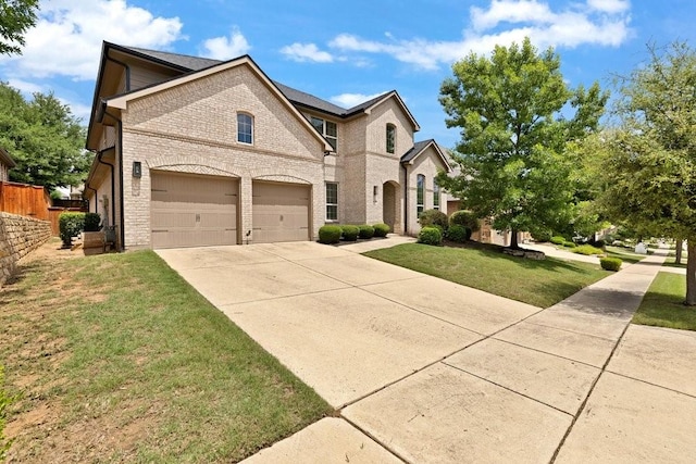 1321 Verbena Ln, Argyle, TX 76226 - view of front of property with brick siding, driveway, a front lawn, and a garage