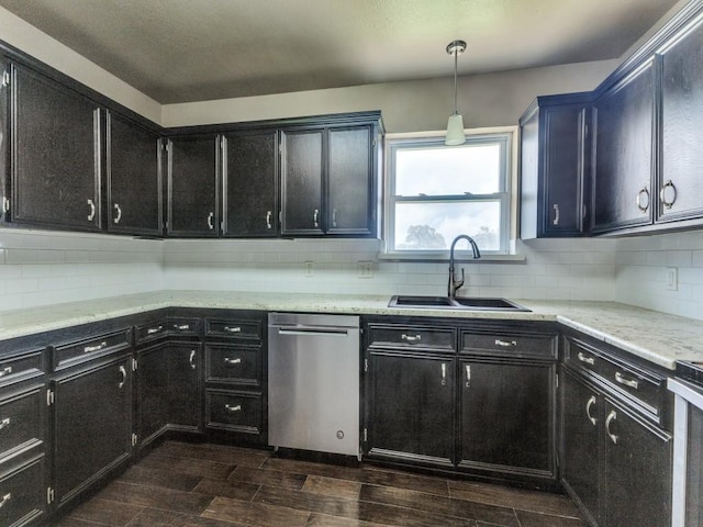 13134 Ravenview Rd, Dallas, TX 75253 - kitchen featuring stainless steel dishwasher, a sink, dark cabinetry, dark wood-style flooring, and backsplash
