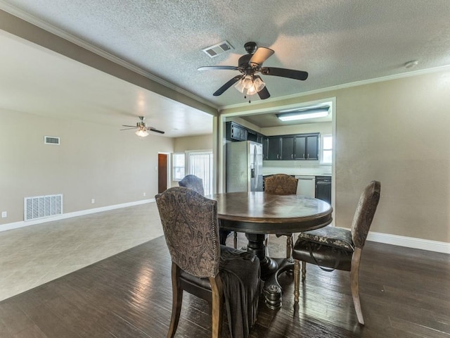13134 Ravenview Rd, Dallas, TX 75253 - dining room featuring crown molding, a ceiling fan, baseboards, a textured ceiling, and dark wood finished floors