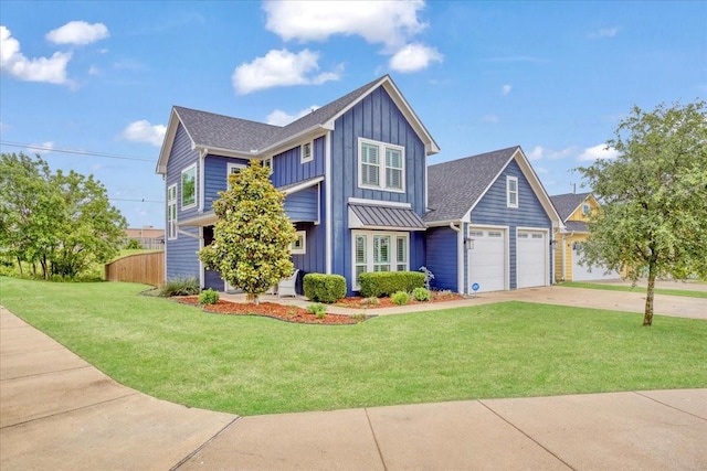craftsman house featuring board and batten siding, an attached garage, and driveway