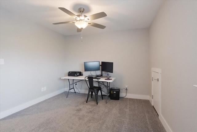 office with a ceiling fan, carpet, and baseboards