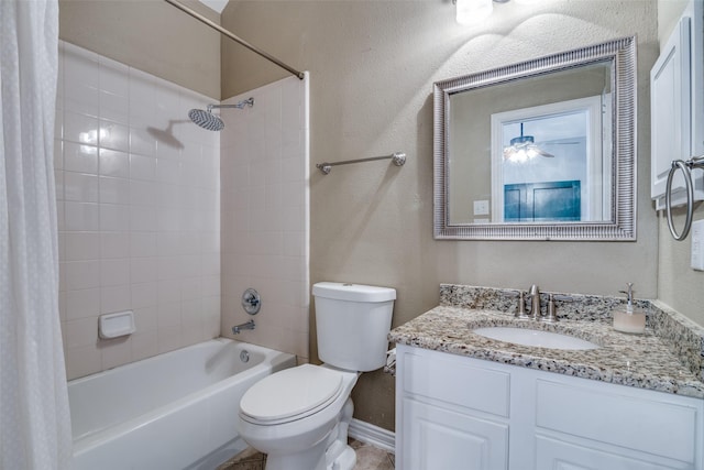 full bathroom featuring toilet, shower / bath combo, baseboards, vanity, and a textured wall