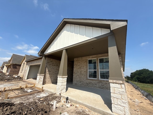 400 Tollett Dr, Aledo, TX 76008 - view of front of home featuring an attached garage, brick siding, and board and batten siding