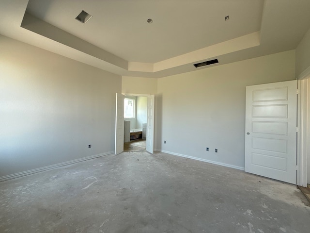 400 Tollett Dr, Aledo, TX 76008 - unfurnished bedroom with a raised ceiling, unfinished concrete floors, and baseboards