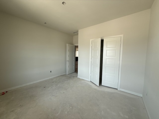 400 Tollett Dr, Aledo, TX 76008 - unfurnished bedroom with concrete flooring, baseboards, and a closet