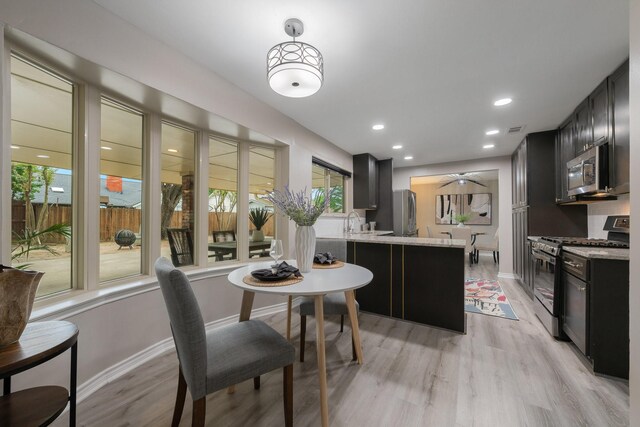 3809 Runge Ct E, Irving, TX 75038 - dining space with light wood-style floors, baseboards, ceiling fan, and recessed lighting