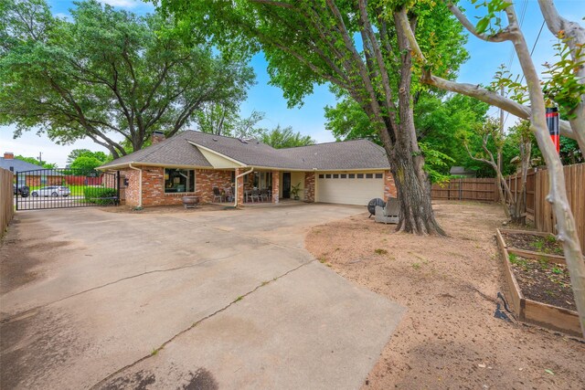 3809 Runge Ct E, Irving, TX 75038 - ranch-style house featuring an attached garage, driveway, brick siding, a shingled roof, and fence