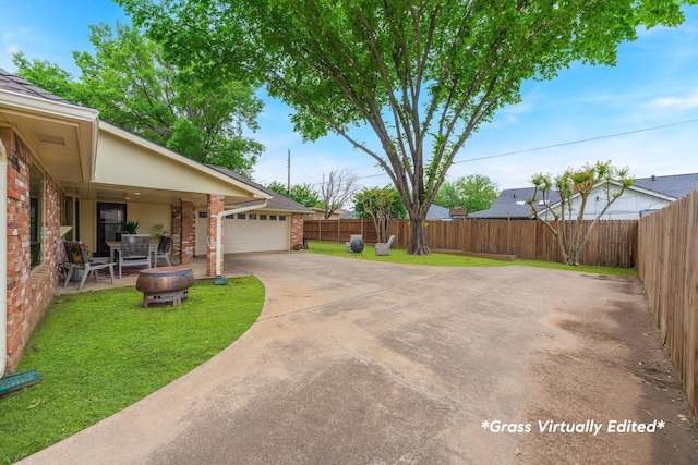 3809 Runge Ct E, Irving, TX 75038 - view of yard featuring driveway and an attached garage