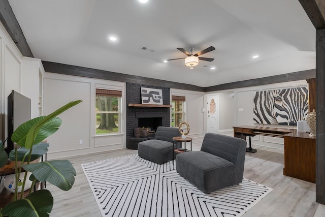 3809 Runge Ct E, Irving, TX 75038 - living area with light wood-style floors, ceiling fan, recessed lighting, a brick fireplace, and baseboards
