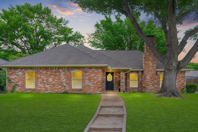 3809 Runge Ct E, Irving, TX 75038 - ranch-style home with a chimney, a shingled roof, a lawn, and brick siding