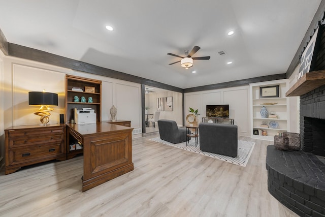 3809 Runge Ct E, Irving, TX 75038 - office featuring a ceiling fan, a fireplace, light wood-style flooring, recessed lighting, and built in features