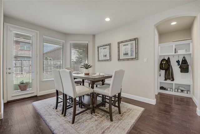 4458 Hartebeest Trl, Frisco, TX 75034 - dining space featuring arched walkways, baseboards, dark wood-type flooring, and recessed lighting