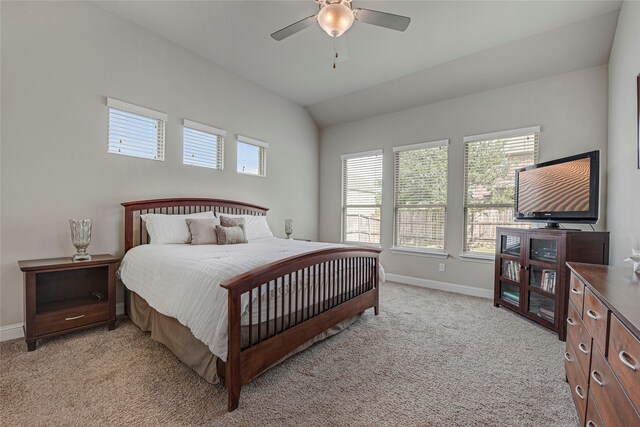 4458 Hartebeest Trl, Frisco, TX 75034 - bedroom featuring baseboards, light colored carpet, vaulted ceiling, and a ceiling fan