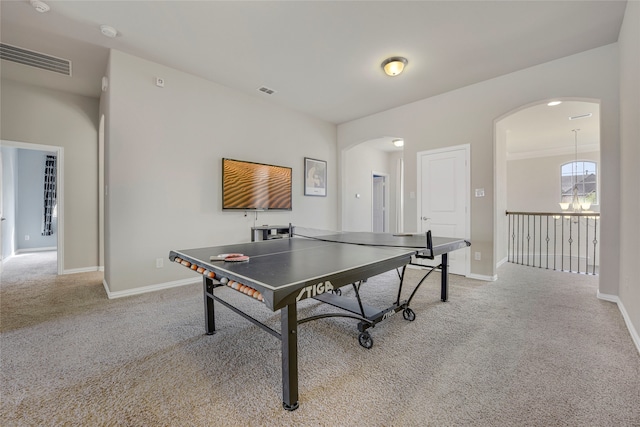 4458 Hartebeest Trl, Frisco, TX 75034 - recreation room with arched walkways, light carpet, and baseboards