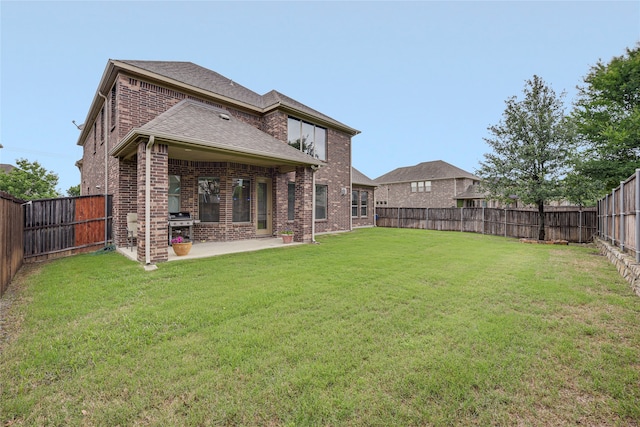 4458 Hartebeest Trl, Frisco, TX 75034 - rear view of house featuring brick siding, a patio, and roof with shingles