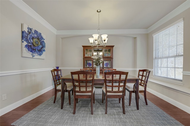 4458 Hartebeest Trl, Frisco, TX 75034 - dining room with a chandelier, wood finished floors, crown molding, and baseboards