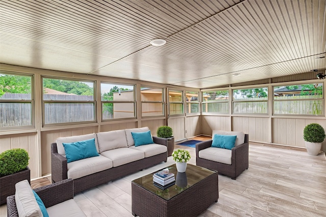 5504 Shady Meadow St, North Richland Hills, TX 76180 - sunroom with an outdoor hangout area, plenty of natural light, wood finished floors, and wood walls