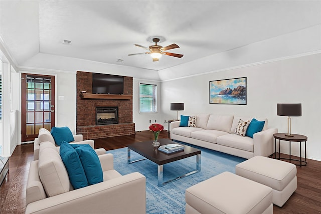 5504 Shady Meadow St, North Richland Hills, TX 76180 - living area with wood finished floors, a raised ceiling, a ceiling fan, vaulted ceiling, and a brick fireplace