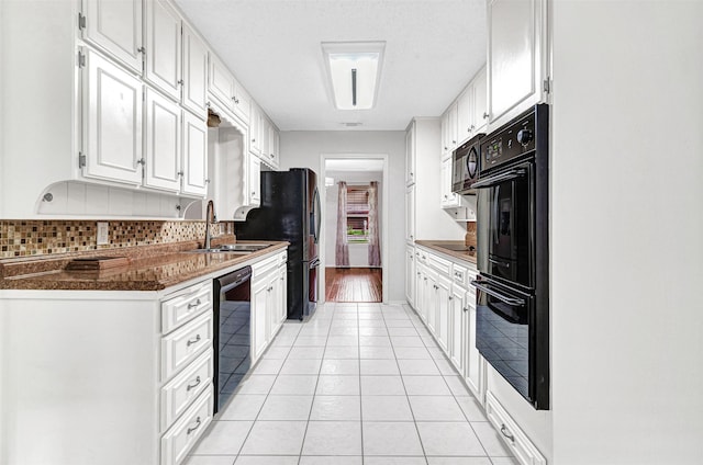 5504 Shady Meadow St, North Richland Hills, TX 76180 - kitchen with black appliances, light tile patterned floors, a sink, white cabinetry, and backsplash