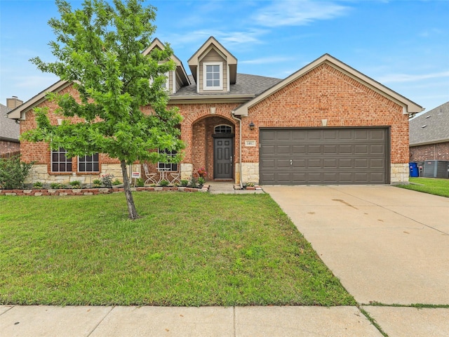 14812 Lone Spring Dr, Little Elm, TX 75068 - traditional-style home with brick siding, a front yard, concrete driveway, a garage, and stone siding