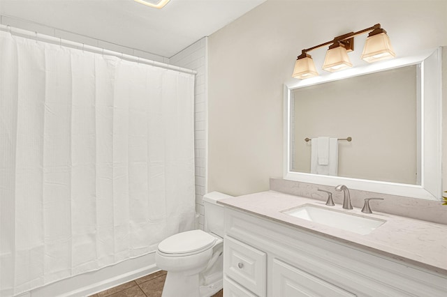 bathroom featuring tile patterned floors, toilet, vanity, and shower / bath combination with curtain
