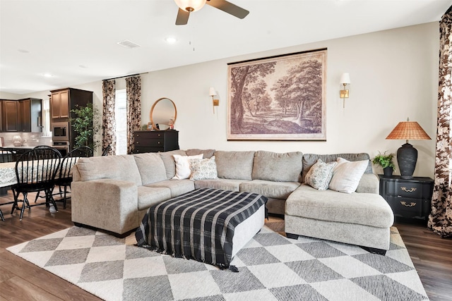 living room with wood finished floors, ceiling fan, and recessed lighting