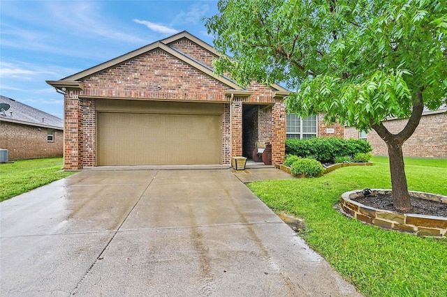 view of front facade featuring an attached garage, a front lawn, driveway, and brick siding