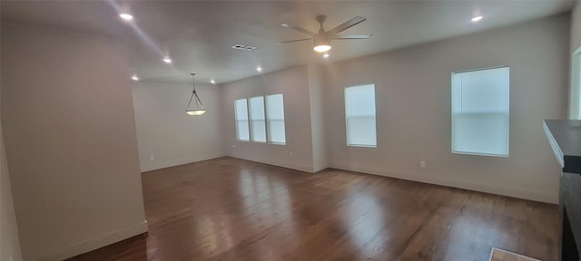 unfurnished living room featuring a ceiling fan, wood finished floors, recessed lighting, and baseboards