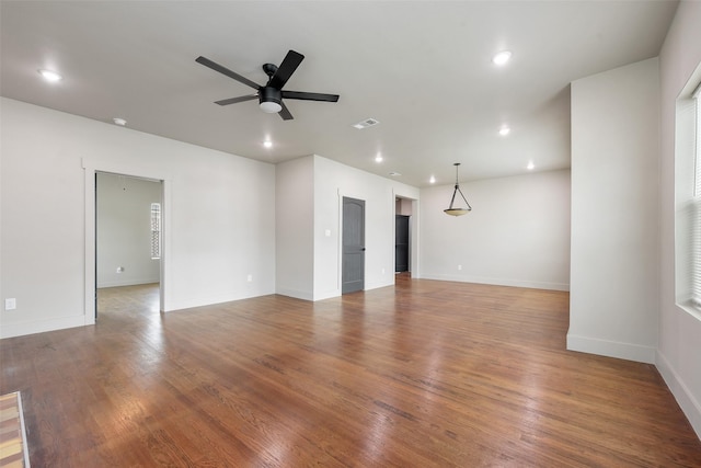 2735 S Jennings Ave, Fort Worth, TX 76110 - unfurnished living room with a ceiling fan, recessed lighting, baseboards, and wood finished floors