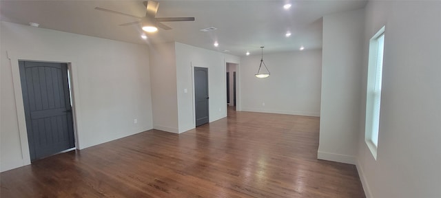 empty room with a ceiling fan, wood finished floors, baseboards, and recessed lighting