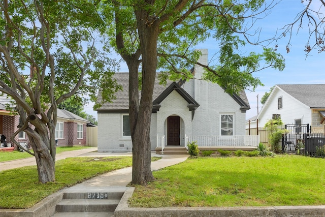 2735 S Jennings Ave, Fort Worth, TX 76110 - view of front facade featuring brick siding, a chimney, and a shingled roof