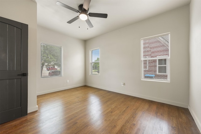 2735 S Jennings Ave, Fort Worth, TX 76110 - empty room with wood finished floors, baseboards, and ceiling fan