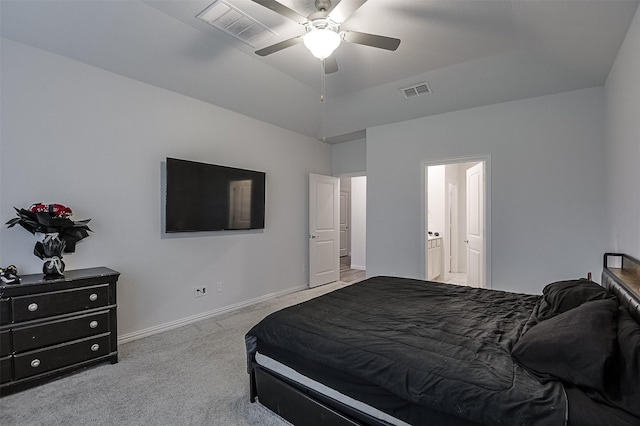 carpeted bedroom featuring baseboards, ensuite bathroom, and ceiling fan
