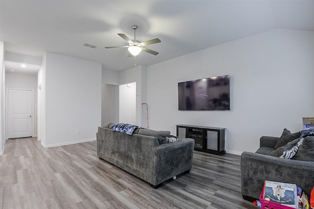living room with wood finished floors, a ceiling fan, baseboards, and recessed lighting