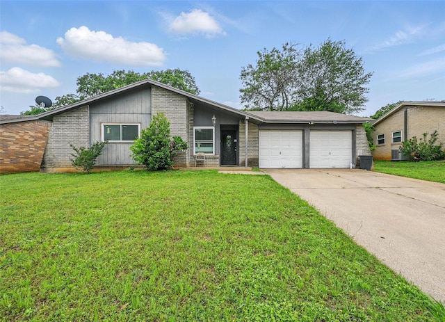 mid-century inspired home with brick siding, an attached garage, and a front yard