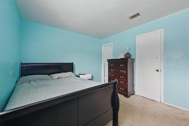 bedroom with light carpet