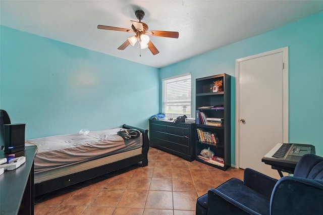 bedroom featuring tile patterned floors and a ceiling fan