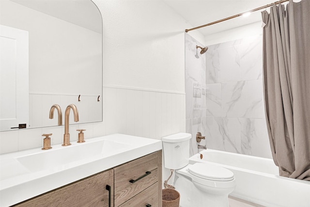 303 Randy Lee Ln, Mckinney, TX 75071 - bathroom with toilet, a wainscoted wall, shower / tub combo, and vanity